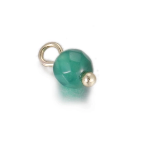 Macro detail of faceted green agate stone pendant with silver metal ring and base
