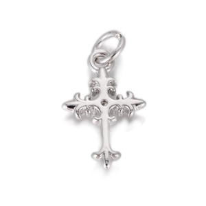 Detailed macro view of a Gothic style silver cross pendant with intricate floral engravings