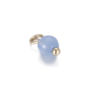 Close-up of a light blue natural stone bead pendant with light gold metal findings for DIY
