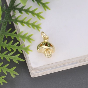 Polished gold mushroom pendant charm with cutout design and circular jump ring