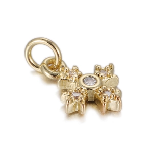 Close-up of a 14k gold plated cross pendant with shimmering zircon stone settings