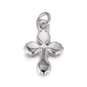 Detailed view of silver cross pendant with petal edges and polished metallic finish