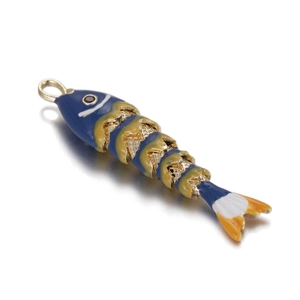 Articulated koi fish pendant with blue enamel and golden movable segments on white