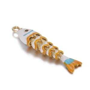 Detail of movable goldfish pendant with colorful enamel and gold-plated alloy