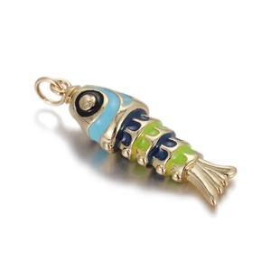 Macro detail of a colorful enamel fish pendant with gold metal finish and top jump ring