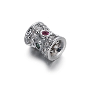 Macro detail of silver charm bead with multicolored cubic zirconia stone pavé setting
