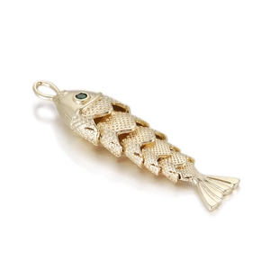 Articulated gold koi fish pendant with green gemstone eye and detailed metallic scales