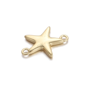 Macro detail of a gold starfish charm with double connectors for DIY jewelry making