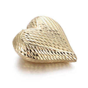 Golden heart-shaped pendant with diamond-cut diamond texture on a white background
