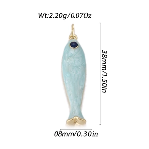 Blue enamel koi fish pendant with gold edging and blue gemstone eye detail, 38mm length