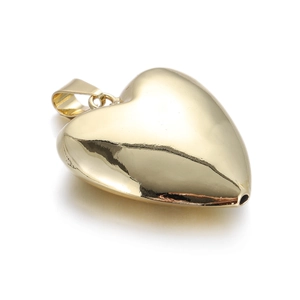 Detailed close-up of a heart-shaped 14k gold plated charm with polished finish