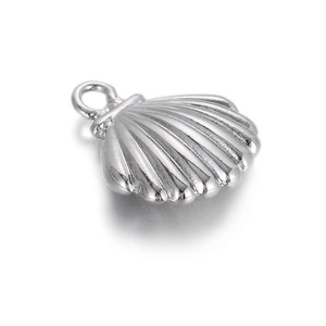 Close-up of a silver shell charm with radial texture and polished metal finish
