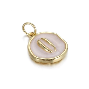 Detailed macro view of a gold-plated circular ocean pendant with pink enamel and a seashell