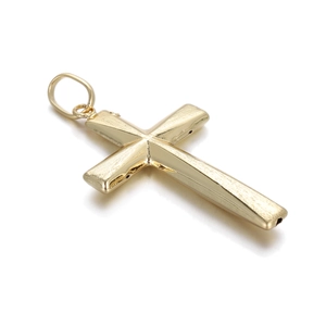 Close-up of golden cross pendant with brushed texture and circular hanging ring
