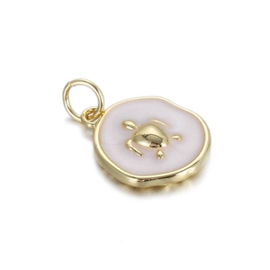 Detail of a gold turtle pendant with white enamel inlay for DIY necklaces