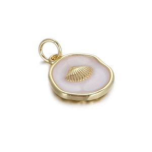 Macro view of gold ocean pendant with pink enamel finish and central shell relief