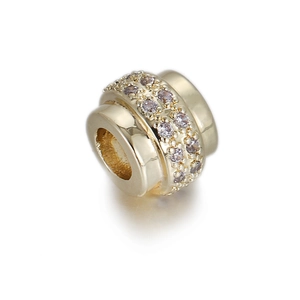 Detailed close-up of 14k gold plated cylinder charm with double row pink zircon stones