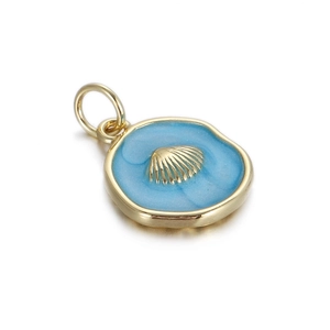 Macro shot of gold shell charm with sky blue enamel finish on a circular metal pendant