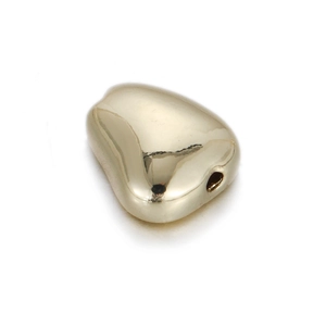 Detailed view of polished 14k gold-plated pebble bead with center hole for DIY jewelry
