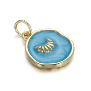Detailed close-up of a mini round blue enamel ocean pendant with golden metal textures