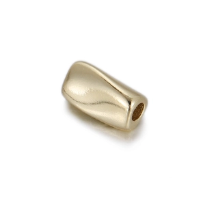 Detailed macro view of 14K gold plated bead with smooth polished finish and central hole