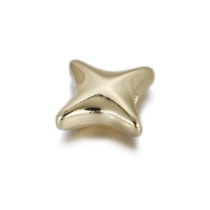 Detailed macro view of a 14k gold-plated star-shaped copper bead for DIY jewelry making