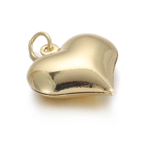 Detailed macro view of heart-shaped 14k gold-plated pendant with polished mirror finish