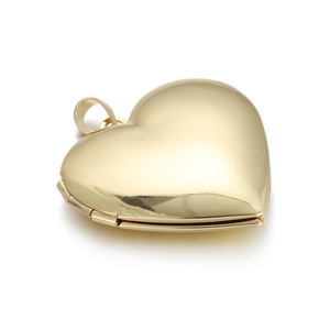 Detailed view of an openable gold heart-shaped locket with polished metal finish