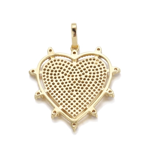 Macro view of gold heart pendant with honeycomb cutout base for jewelry making