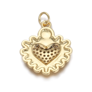 Macro view of gold heart pendant with hollow pattern and scalloped edges for DIY jewelry