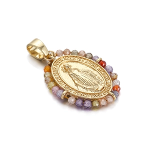 Macro view of gold Virgin Mary oval pendant with colorful beads and embossed detail
