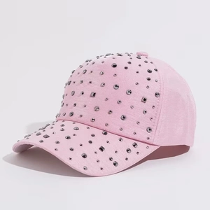 Detailed view of pink baseball cap with sparkling rhinestones and silver crystal embellishments