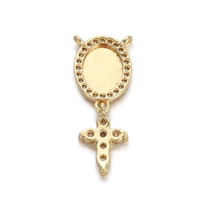 Macro detail of a gold-plated cross pendant with white zircon stones for jewelry DIY