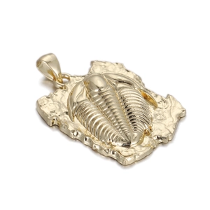 Detailed view of a golden trilobite fossil metal pendant with vintage punk aesthetic
