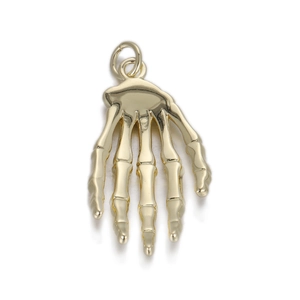 Detailed close-up of a golden skeleton hand pendant with polished metallic finish