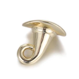 Detail of polished gold horn-shaped copper pendant accessory with smooth mirror finish
