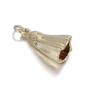 Close-up of a polished gold ghost charm pendant with smooth metallic finish and top ring