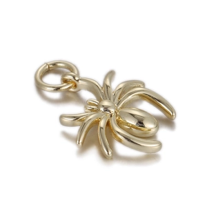 Detailed macro view of gold-plated spider charm pendant for DIY jewelry crafting
