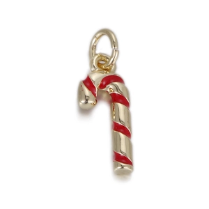 Macro detail of a festive candy cane pendant with red enamel and golden finish