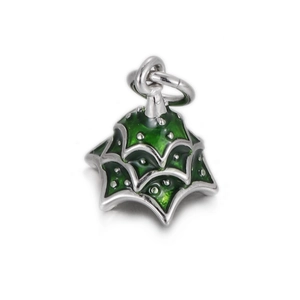 Detailed view of silver pendant with layered green enamel and decorative metal dots