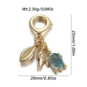 Marine charm set featuring a gold-plated starfish, fish, and turtle with blue gemstone