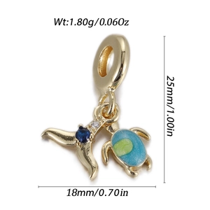 Detailed view of ocean-themed charms with whale tail and sea turtle pendant dimensions