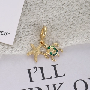 Marine series gold pendant featuring enamel sea turtle and starfish with ocean charms