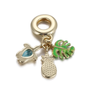 Detailed close-up of ocean-themed charms featuring a sea turtle, pineapple, and green leaf