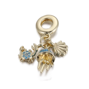 Golden ocean charm featuring a blue zircon crab, enamel jellyfish, and a detailed seashell