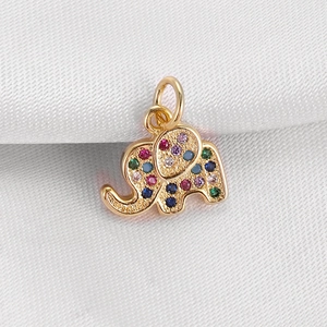 Close-up of golden elephant pendant with vibrant multi-colored cubic zirconia stones