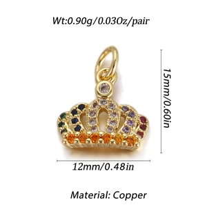 Macro detail of crown pendant with colorful zircon stones in gold plated copper finish