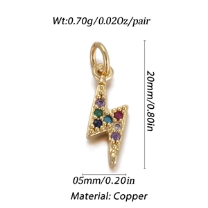 Macro detail of lightning bolt pendant in gold brass with colorful zircon inlay