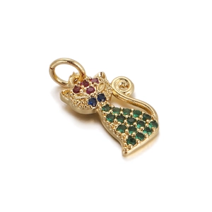 Close-up of golden cat pendant with colorful red, blue, and green rhinestones and ring loop