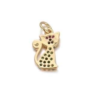 Detail of gold cat pendant with colorful red blue and green zircon stones for jewelry DIY